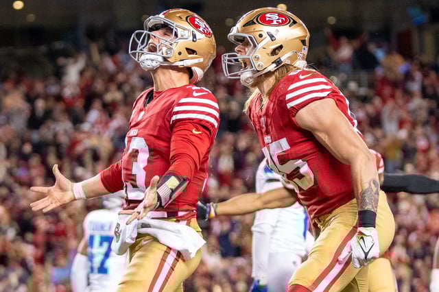 December 30, 2024; Santa Clara, California, USA; San Francisco 49ers quarterback Brock Purdy (13) celebrates with tight end George Kittle (85) after scoring a touchdown against the Detroit Lions during the second quarter at Levi's Stadium. Mandatory Credit: Kyle Terada-Imagn Images