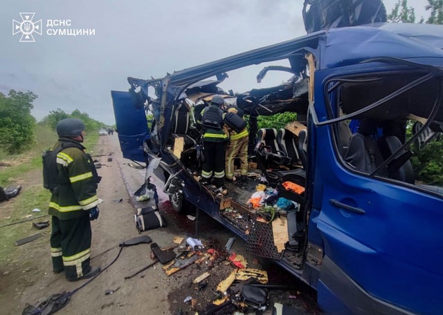Rescuers recover the bodies of passengers after a Russian drone struck a bus in the Sumy region.