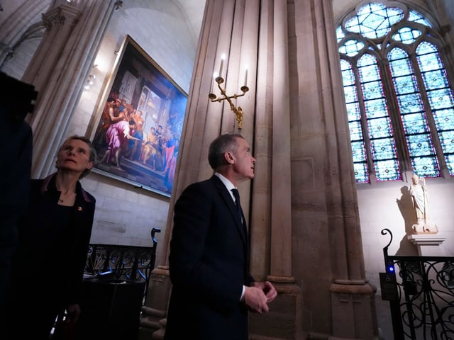 Prime Minister Mark Carney and wife Diana Fox Carney tour Notre-Dame Cathedral in Paris, France on Monday, March 17, 2025. THE CANADIAN PRESS/Sean Kilpatrick