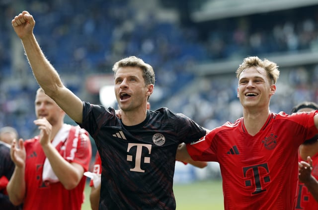 Soccer Football - Bundesliga - TSG 1899 Hoffenheim v Bayern Munich - PreZero Arena, Sinsheim, Germany - May 17, 2025  Bayern Munich's Thomas Muller celebrates with Bayern Munich's Joshua Kimmich after he played his last Bundesliga match for Bayern Munich REUTERS/Heiko Becker