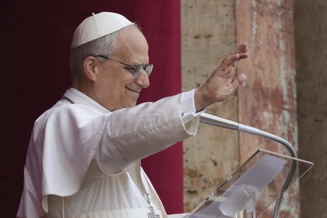 Pope Leo XIV appears at the central balcony of St. Peter&#39;s Basilica for his first Sunday blessing after his election, in St. Peter&#39;s Square at the Vatican, Sunday May 11, 2025.
