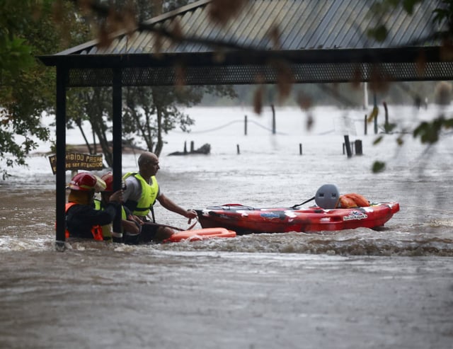 Firefighters work amid flooding caused by heavy rains, in Capilla del Senor, in Buenos Aires, Argentina May 17, 2025. REUTERS/Matias Baglietto