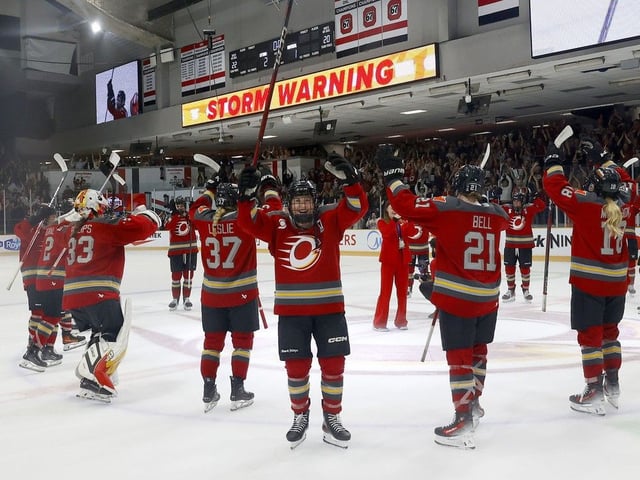 Ottawa Charge players salute the home fans after the team's 2-1 win against the Montreal Victoire on Friday night wrapped up a first-round playoff series and clinched a berth in the PWHL final. 