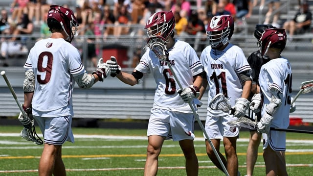 Broadneck celebrates Wyatt Shaw’s, center, goal in the first quarter. The Broadneck Bruins defeated the North County Knights, 20-3, to win an MPSSAA Class 4A Boys lacrosse State Semifinal game at Glen Burnie High School. (Paul W. Gillespie/Staff)