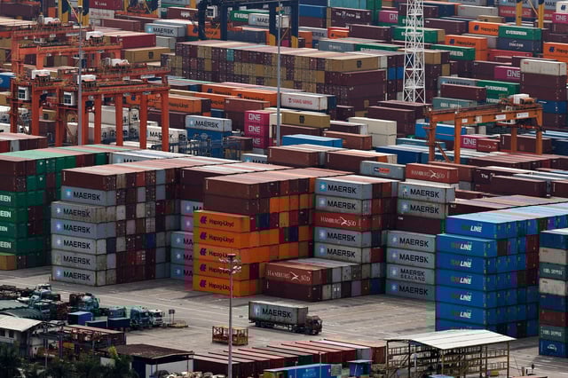 A truck carrying a container moves at the Yantian port in Shenzhen, Guangdong province, China April 17, 2025. REUTERS/Tingshu Wang/File Photo