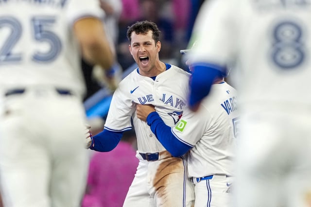 May 17, 2025; Toronto, Ontario, CAN; Toronto Blue Jays third base Ernie Clement (22) celebrates after hitting a walk off single to defeat the Detroit Tigers during the ninth inning in their MLB game at Rogers Centre. Kevin Sousa-Imagn Images