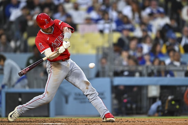 May 17, 2025; Los Angeles, California, USA; Los Angeles Angels catcher Logan O'Hoppe (14) forced out at first base against the Los Angeles Dodgers during the fifth inning at Dodger Stadium. Jonathan Hui-Imagn Images