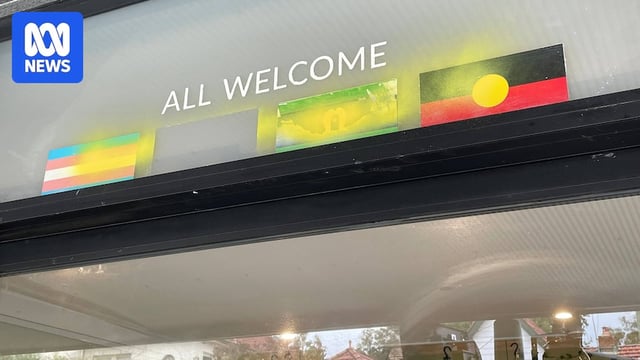 a shopfront in petersham with the window defaced