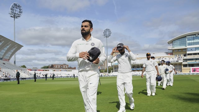 Virat Kohli leads the Indian team off the field after a victory at Trent Bridge in Nottingham.
