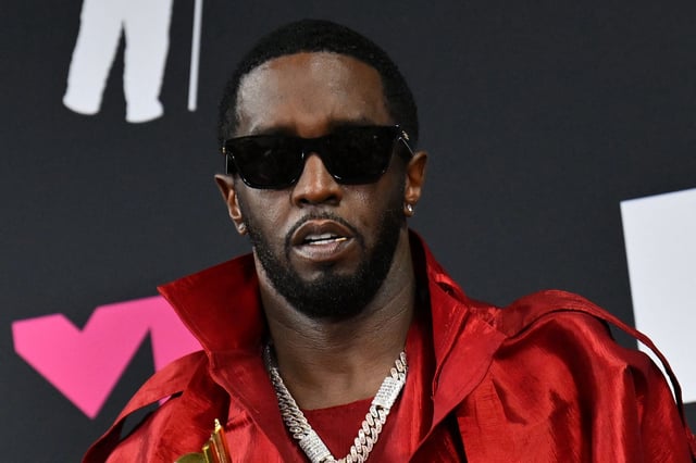 US producer-musician Sean "Diddy" Combs poses with the Global Icon award in the press room during the MTV Video Music Awards at the Prudential Center in Newark, New Jersey, on Sept. 12, 2023.