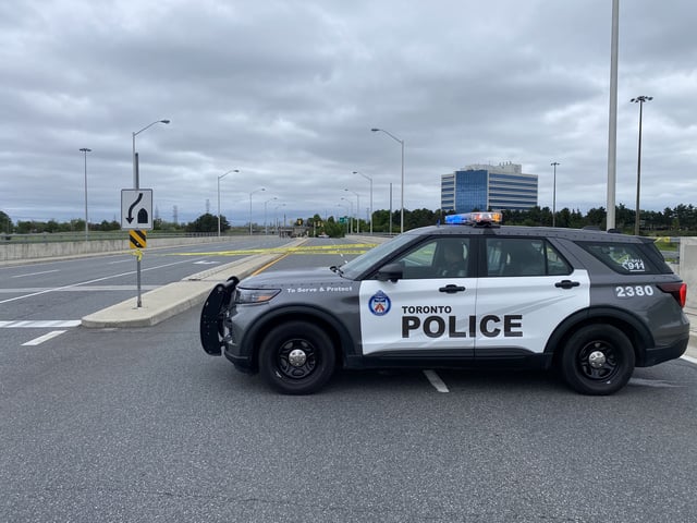 A police vehicle is stationed at the intersection of Renforth Drive and the Renforth Drive exit ramp from Highway 401 in Toronto. Three children were killed in a collision and a 19-year-old was arrested on charges of impaired driving. GLOBAL NEWS/ Max Trotta