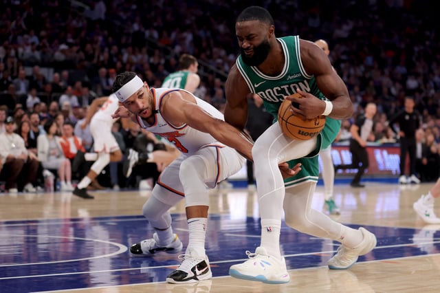 Celtics guard Jaylen Brown tried to keep the ball away from Josh Hart of the Knicks in Game 6 of their NBA playoff series. The Knicks won to eliminate the defending champion Celtics.