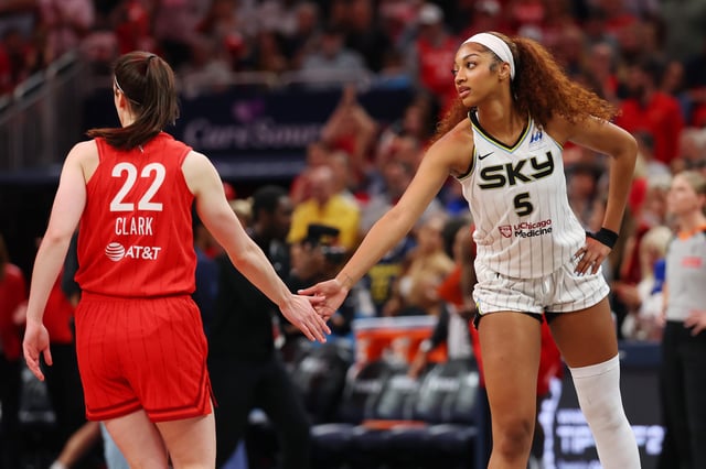 INDIANAPOLIS, INDIANA - MAY 17: Angel Reese #5 of the Chicago Sky and Caitlin Clark #22 of the Indiana Fever meet at mid court prior to tipoff for the Fever&#39;s home opener at Gainbridge Fieldhouse on May 17, 2025 in Indianapolis, Indiana.