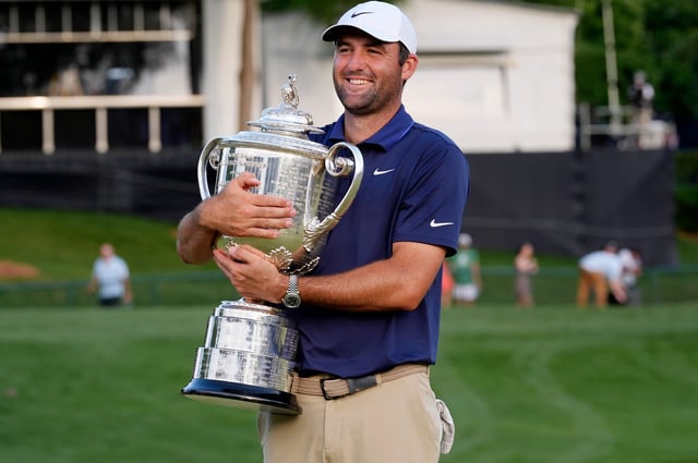 Scottie Scheffler holds the Wanamaker Trophy after winning the PGA Championship golf tournament at Quail Hollow.