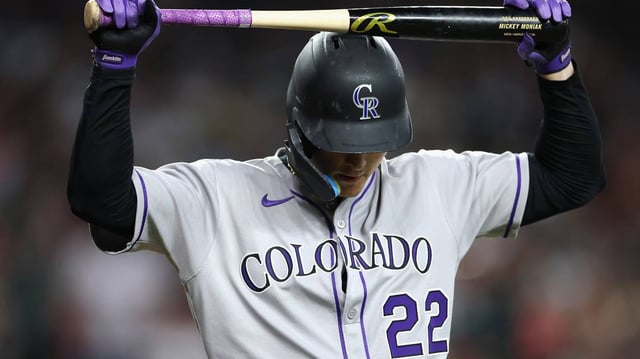 Mickey Moniak (22) of the Colorado Rockies reacts to a strike out against the Arizona Diamondbacks during the eighth inning of the MLB game at Chase Field on Sunday, May 18, 2025, in Phoenix. (Christian Petersen/Getty Images/TNS)