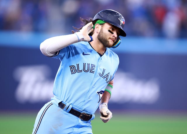 TORONTO, ON - JUNE 06: Bo Bichette #20 of the Toronto Blue Jays rounds the bases after hitting a solo home run in the eighth inning against the Houston Astros at Rogers Centre on June 06, 2023 in Toronto, Canada.