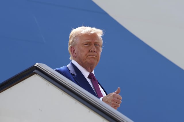 President Donald Trump gives a thumbs up as he boards Air Force One to depart Al Udeid Air Base, Thursday, May 15, 2025, in Doha, Qatar.