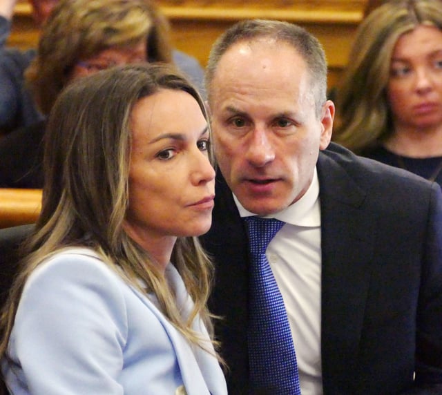 Karen Read listens to her defense attorney David Yannetti as her trial in Norfolk Superior Court in Dedham continues on Wednesday, May 14, 2025.