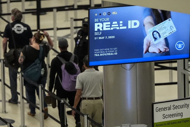 FILE - Travelers move through Hartsfield-Jackson Atlanta International Airport ahead of Memorial Day, Friday, May 24, 2024, in Atlanta.(AP Photo/Mike Stewart, File)