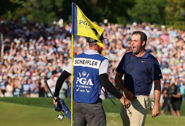 Scottie Scheffler celebrates with his caddie, Ted Scott, on the 18th green after winning the 2025 PGA Championship at Quail Hollow Country Club. (Photo by Alex Slitz/Getty Images)