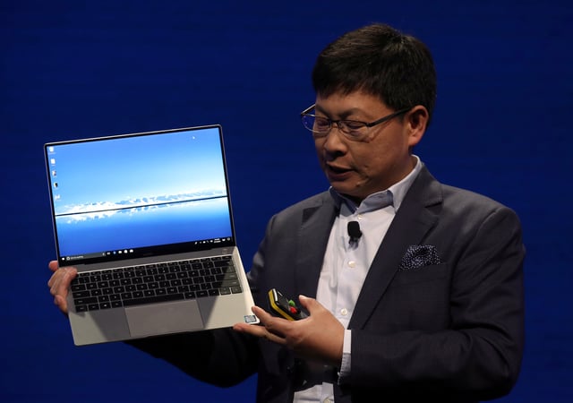 Richard Yu, CEO of the Huawei Consumer Business Group, presents the new "MateBook X Pro" laptop before the Mobile World Congress in Barcelona, Spain, February 25, 2018.  REUTERS/Albert Gea/File Photo