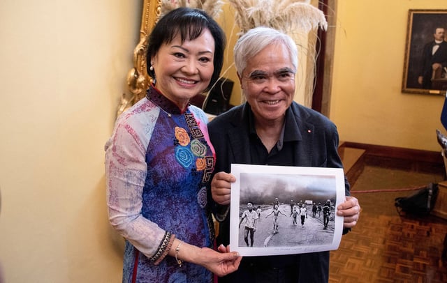 The photograph's subject Kim Phuc Phan Thi, who survived her injuries, poses with retired AP photographer Nick Ut in 2023.