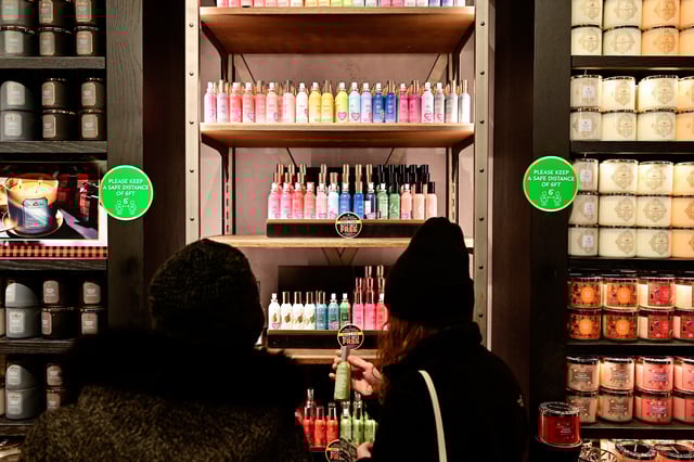 People shop in a Bath & Body Works store as Black Friday sales begin at The Outlet Shoppes of the Bluegrass in Simpsonville, Kentucky, U.S., November 26, 2021. REUTERS/Jon Cherry/File Photo