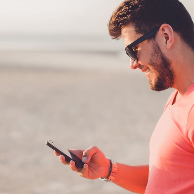 Man using iPhone.