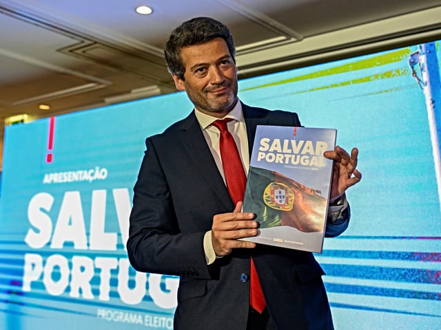LISBON, PORTUGAL - APRIL 23: Far-right Chega Party president and MP André Ventura displays "Salvar Portugal" (Save Portugal) book after the presentation of Chega Electoral Program for next parliamentary election on April 23, 2025, in Lisbon, Portugal. Portugal faces on May 18 a third general election in just over three years as Parliament rejected a motion of confidence asked by Prime Minister Luis Montenegro after the opposition questioned his integrity over the dealings of a consultancy firm he founded, which is now run by his sons. (Photo by Horacio Villalobos#Corbis/Corbis via Getty Images)