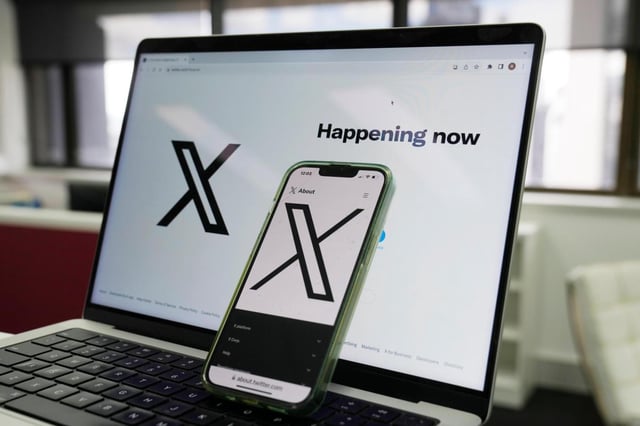 FILE – The opening page of X is displayed on a computer and phone, Oct. 16, 2023, in Sydney. The social media platform X says it will now allow people to show consensual adult content, as long as it is clearly labeled as such. The move formalizes a policy already in place when the platform was known as Twitter, before billionaire Elon Musk purchased it in 2022. (AP Photo/Rick Rycroft, File)