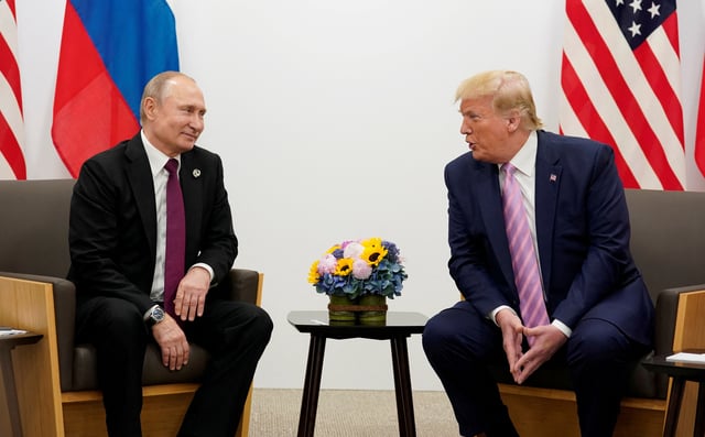 Russia's President Vladimir Putin and U.S. President Donald Trump talk during a bilateral meeting at the G20 leaders summit in Osaka, Japan, June 28, 2019.  REUTERS/Kevin Lamarque/File Photo