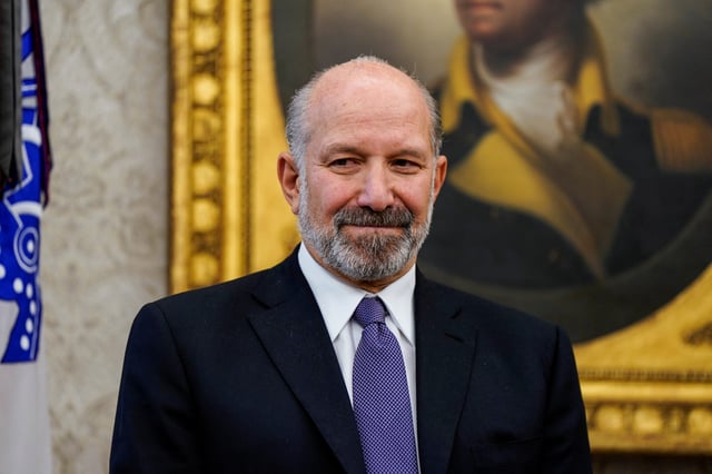 Howard Lutnick stands near U.S President Donald Trump (not pictured), at the White House, in Washington, U.S. February 3, 2025. REUTERS/Elizabeth Frantz