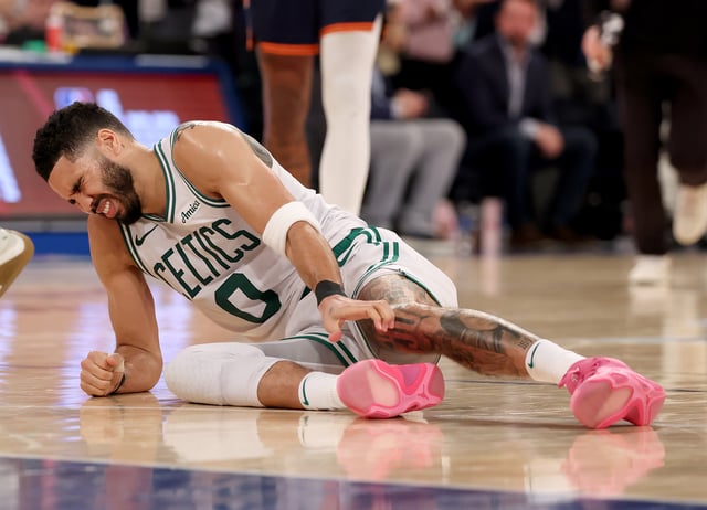 NEW YORK, NEW YORK - MAY 12: Jayson Tatum #0 of the Boston Celtics lays on the ground after being injured against the New York Knicks during the fourth quarter in Game Four of the Eastern Conference Second Round NBA Playoffs at Madison Square Garden on May 12, 2025 in New York City.