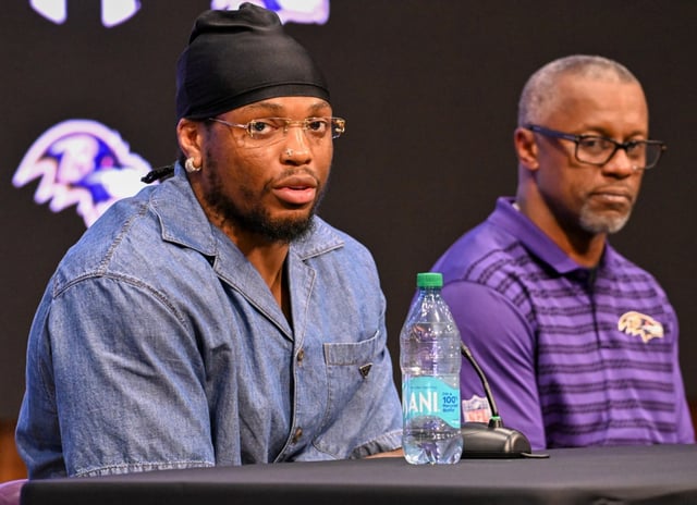 Ravens running back Derrick Henry, left,  and assistant head coach/running backs Willie Taggart speaks to media during a press conference at the Under Armour Performance Center. (Kevin Richardson/Staff)