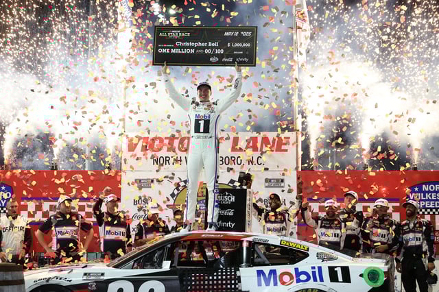 Christopher Bell, driver of the #20 Mobil 1 Toyota, celebrates in Victory Lane after winning the NASCAR Cup Series All-Star Race at North Wilkesboro Speedway on May 18, 2025 in North Wilkesboro, North Carolina.