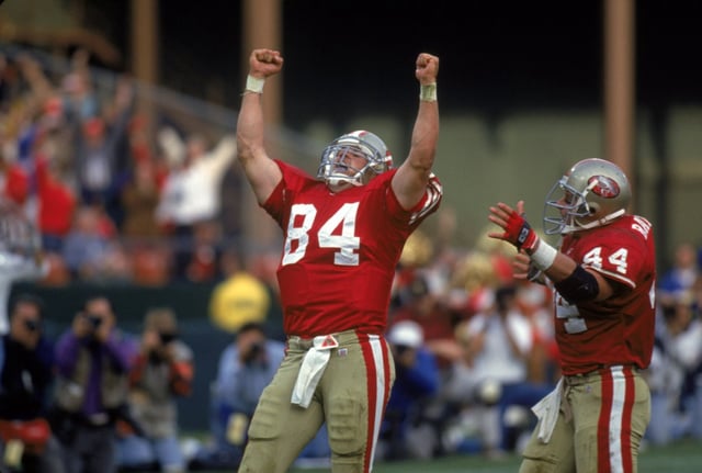 SAN FRANCISCO – NOVEMBER 15:  Tight end Brent Jones #84 of the San Francisco 49ers celebrates his 8-yard touchdown reception with :46 left to win the game against the New Orleans Saints at Candlestick Park on November 15, 1992 in San Francisco, California.  The 49ers won 21-20.  (Photo by George Rose/Getty Images)