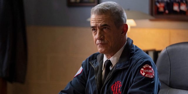 Chief Pascal (Dermot Mulroney) looks up from his desk in Chicago Fire.