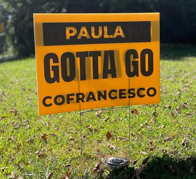 Signs calling for Bethany First Selectwoman Paula Cofrancesco to resign over an alleged child molester have begun springing up in town. (Courtesy of Naomi Rosenstein)