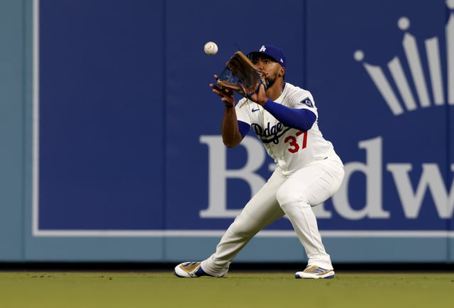 Apr 28, 2025; Los Angeles, California, USA; Los Angeles Dodgers outfielder Teoscar Hernandez (37) makes a catch during the eighth inning against the Miami Marlins at Dodger Stadium. Mandatory Credit: Jason Parkhurst-Imagn Images