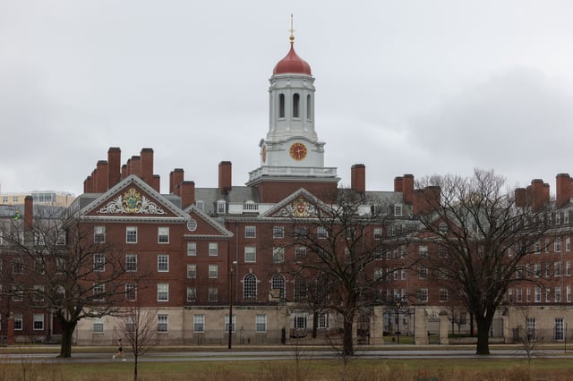 A person runs past Dunster House at Harvard University on March 17, 2025 in Cambridge, Massachusetts.