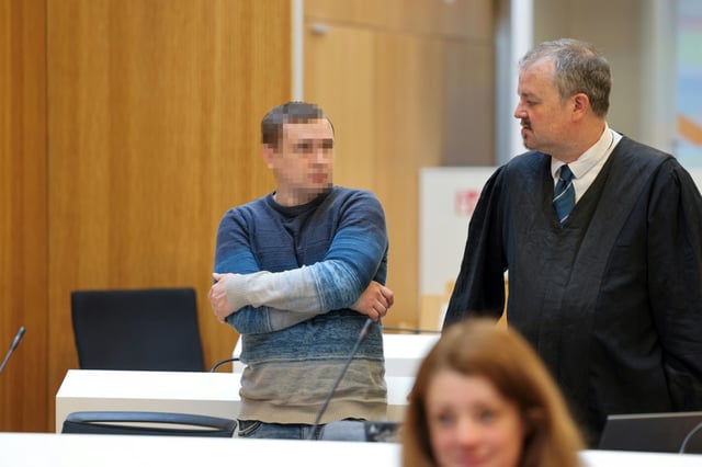 Defendant Alex D , stands next to lawyer Arne Bodenstein prior to the start of his trial for spying for Moscow and readying attacks on critical military infrastructure and industry in a court in Munich, southern Germany, on May 20, 2025. Three German-Russian dual nationals will go on trial in Munich on May 20, accused of spying for Moscow and readying attacks on critical military infrastructure and industry. The main suspect, named only as Dieter S, is said to have been at the centre of a plot to undermine Germany's support for Ukraine through acts of sabotage aimed at targets including US military bases.