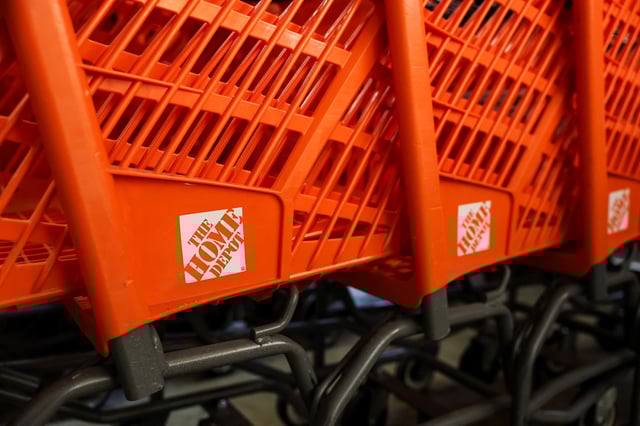 Logos are displaed on shopping carts at a Home Depot store in Manhattan in New York City, U.S.,  February 25, 2025. REUTERS/Jeenah Moon/File Photo