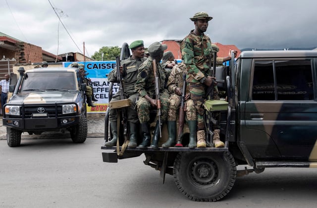 Members of the M23 rebel group mount their vehicles after the opening ceremony of Caisse Generale d'epargne du Congo in Goma, North Kivu province in the East of the Democratic Republic of Congo, April 7, 2025. REUTERS/Arlette Bashizi/File Photo