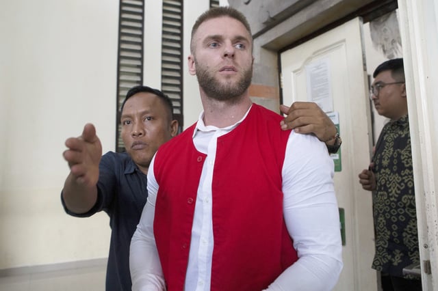 British citizen Thomas Parker, center, who is accused of drug offenses walks to a holding cell after his trial hearing at a district court in Denpasar, Bali, Indonesia, Tuesday, May 20, 2025. (AP Photo/Firdia Lisnawati)