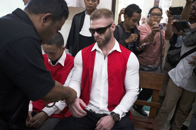 British citizen Thomas Parker who is accused of drug offenses sits on the defendant's chair before the start of his trial hearing at a district court in Denpasar, Bali, Indonesia, Tuesday, May 20, 2025. (AP Photo/Firdia Lisnawati)