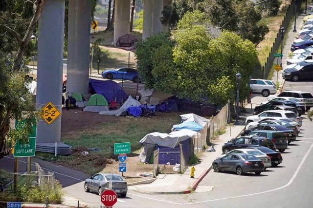 A homeless encampment off the I-5 in downtown San Diego, California. (Alejandro Tamayo / The San Diego Union-Tribune)