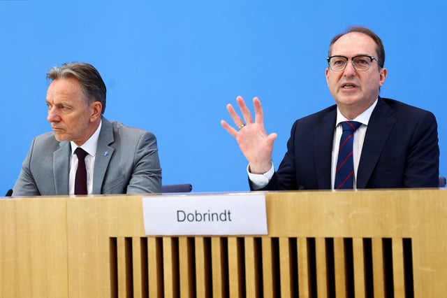 German Interior Minister Alexander Dobrindt and German Federal Criminal Police Office (BKA) President Holger Muench, attend a press conference on Figures For Politically Motivated Crime in the Country, in Berlin, Germany, May 20, 2025. REUTERS/Lisi Niesner