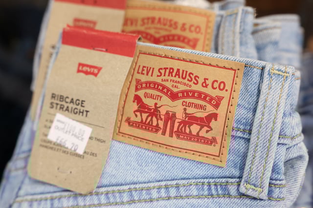 A logo is displayed on a pair of jeans at the Levi’s outlet retail store at Bicester Village in Oxfordshire, Britain, August 21, 2024. REUTERS/Hollie Adams/File Photo