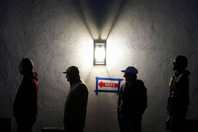 Voters stand in line outside a polling place at Madison Church in Phoenix on November 5, 2024.