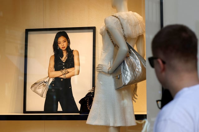 A man looks at a Chanel shop window at Bahnhofstrasse in Zurich, Switzerland April 30, 2025. REUTERS/Stefan Wermuth/File Photo